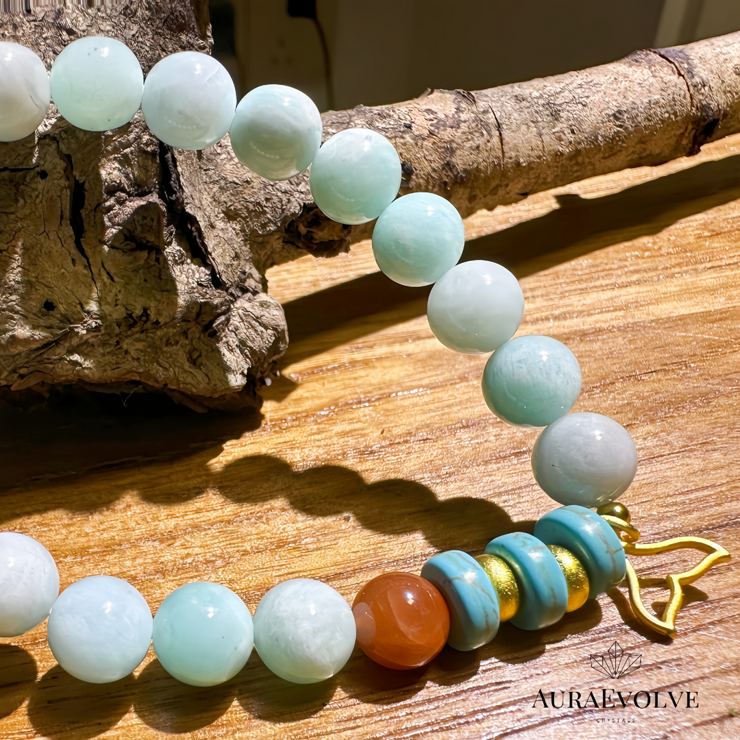 A crystal bracelet made with Amazonite, Red Rutilated Quartz and Chrysocolla