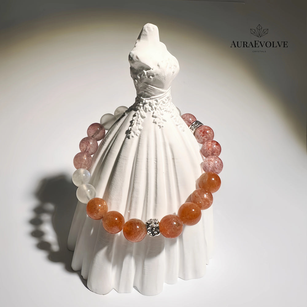 A crystal bracelet made with arusha sunstone and strawberry quartz and moonstone