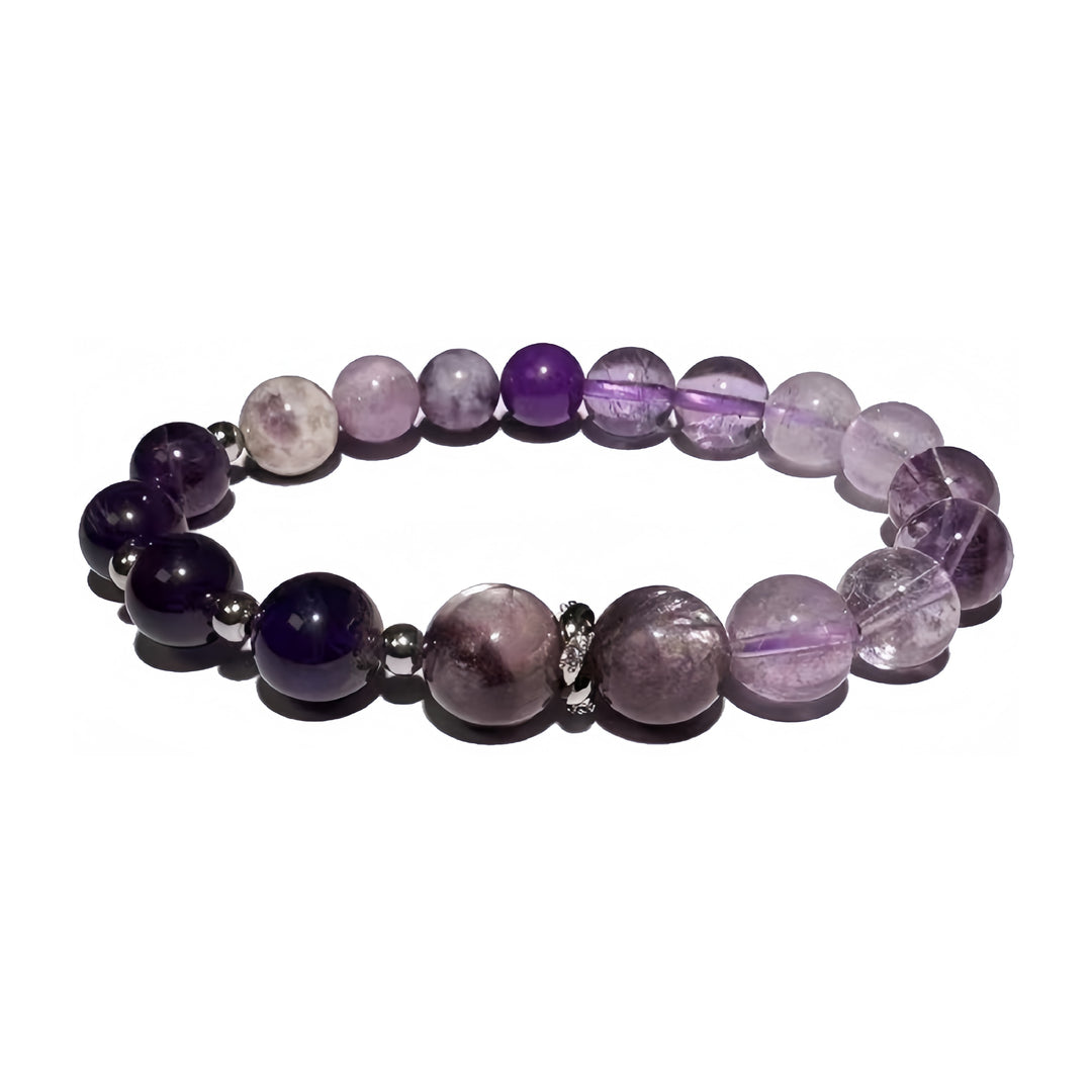 A crystal bracelet made with Purple Rutilated Quartz, Phosphosiderite, Kunzite, Lepidolite and Amethyst