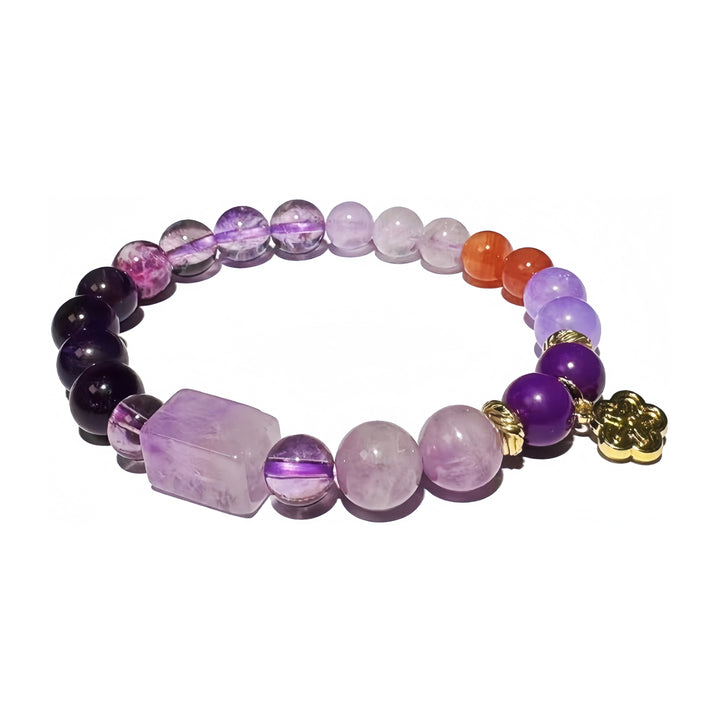 A crystal bracelet made with Amethyst, Lepidolite, Purple Chalcedony, Phosphosiderite and Yanyuan Agate