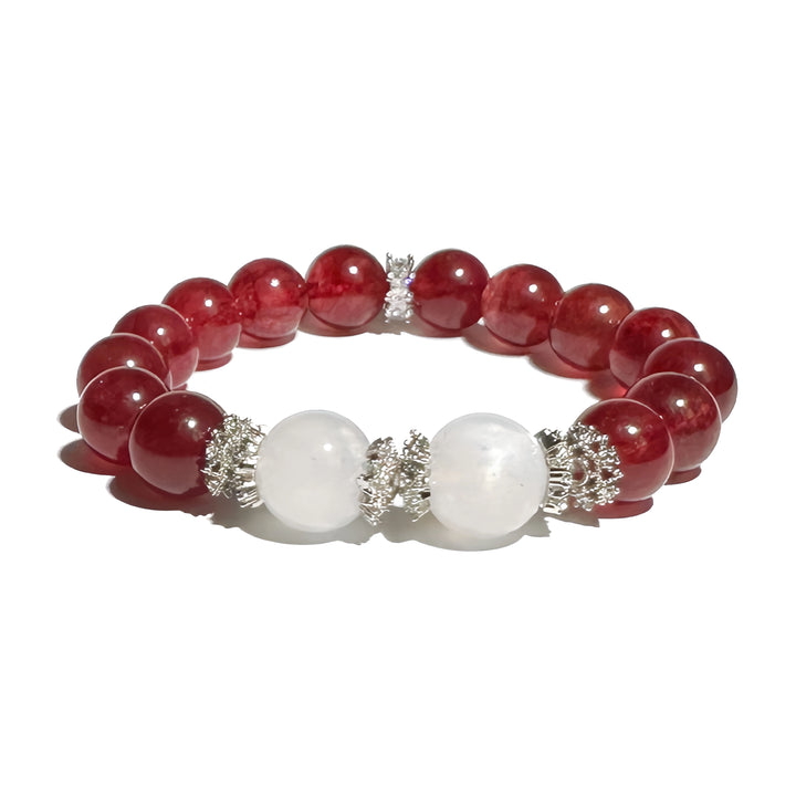 A crystal bracelet made with strawberry quartz and moonstone