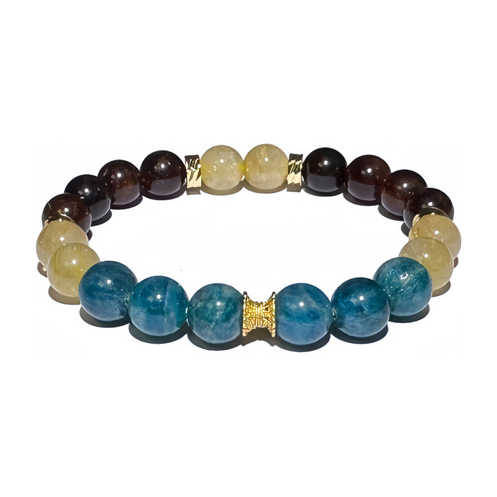 A crystal bracelet made with Blue Apatite, Garnet and Rutilated Quartz